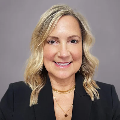 A headshot of Christine Sivak, a Financial Advisor at SEIA, wearing a black suit jacket and white shirt.